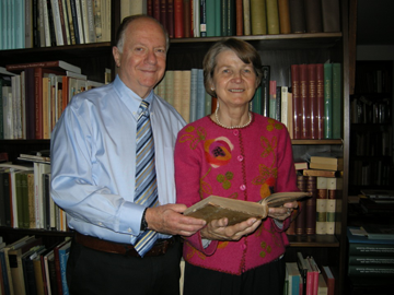 Drs. Sheldon and Leena Peck in their home library